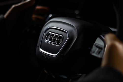 Free Detailed shot of the Audi steering wheel, showcasing elegant car branding. Captured in Toronto studio lighting. Stock Photo