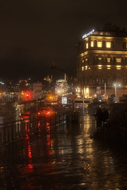 Free Moody nighttime view of a rainy street in Istanbul with illuminated buildings. Stock Photo