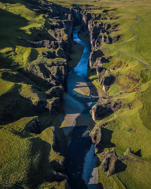 Body of Water Between Mountains