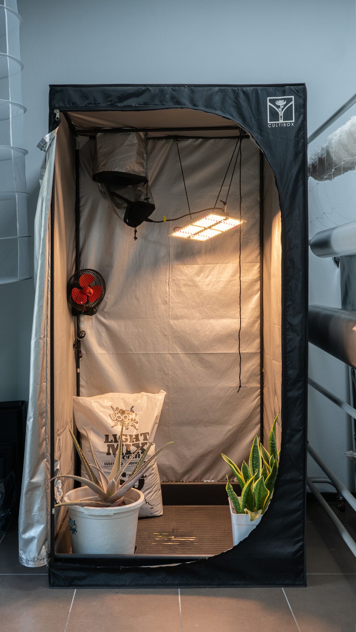 Indoor grow tent with LED light, fan and pots