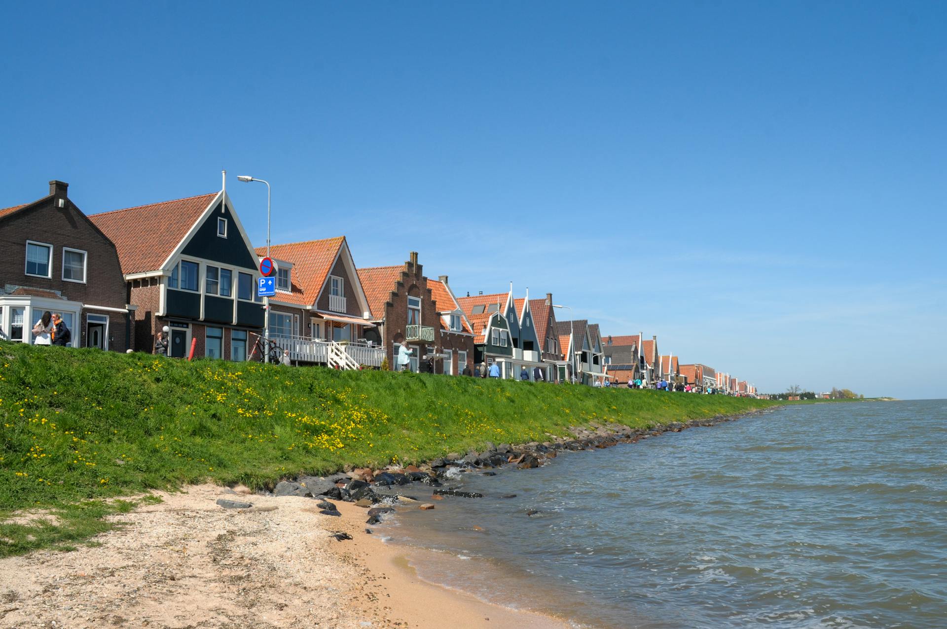 Scenic view of historic houses along the Volendam shoreline in North Holland, Netherlands.