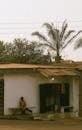Solitary Child Sitting Near Street Shop in Enugu