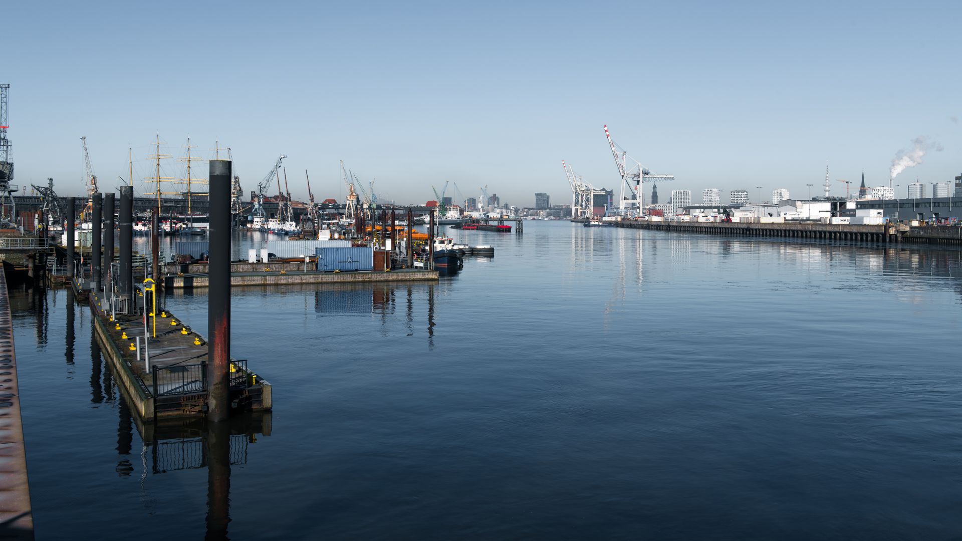 Panoramic shot of shipping cranes and boats at Hamburg Port, Germany.