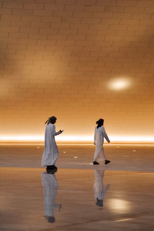 Two People Walking in Modern Architecture · Free Stock Photo