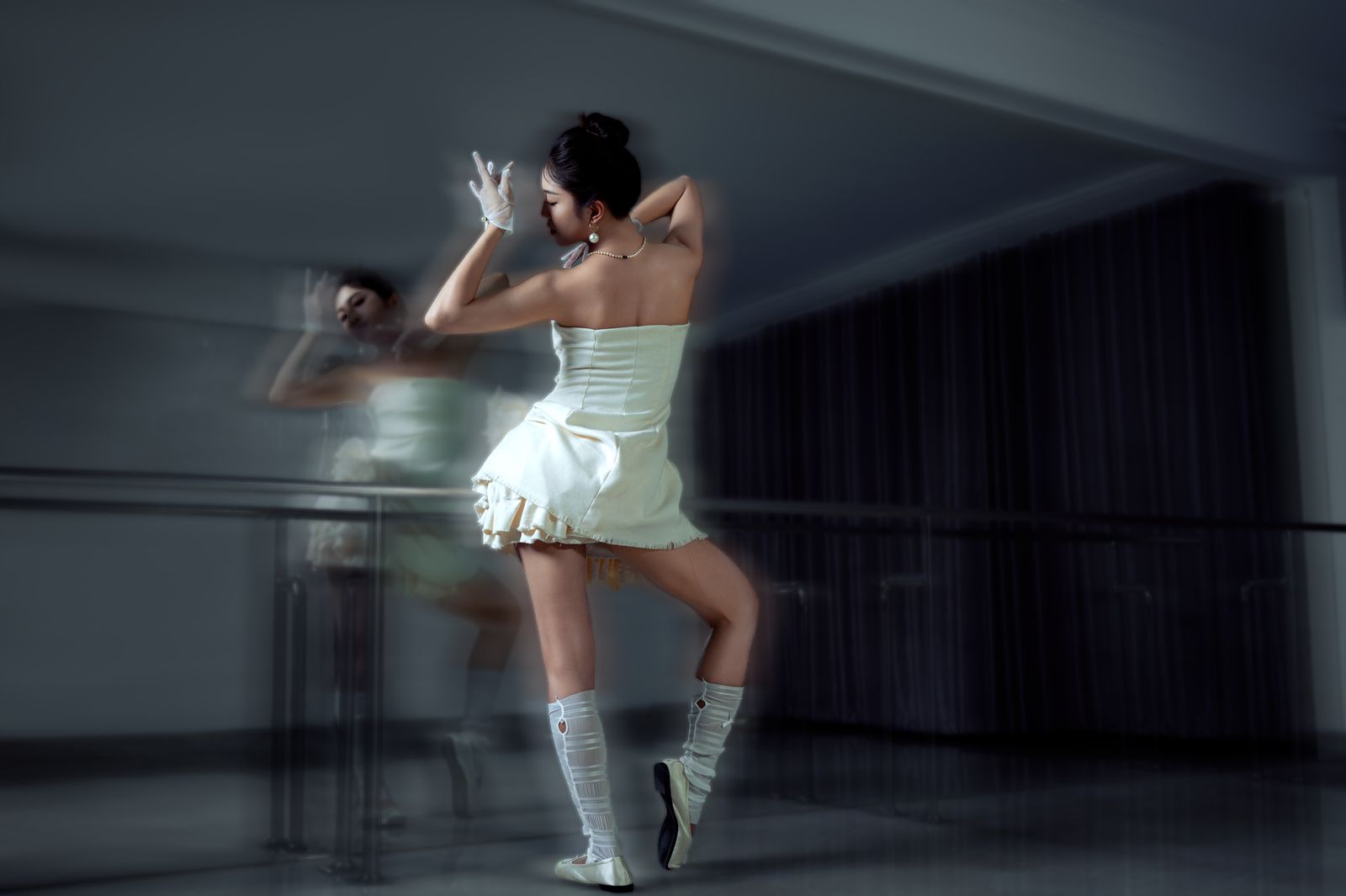 Long-exposure photograph of a dancer turning in a lit room. Photo by Đậu Photograph on Pexels
