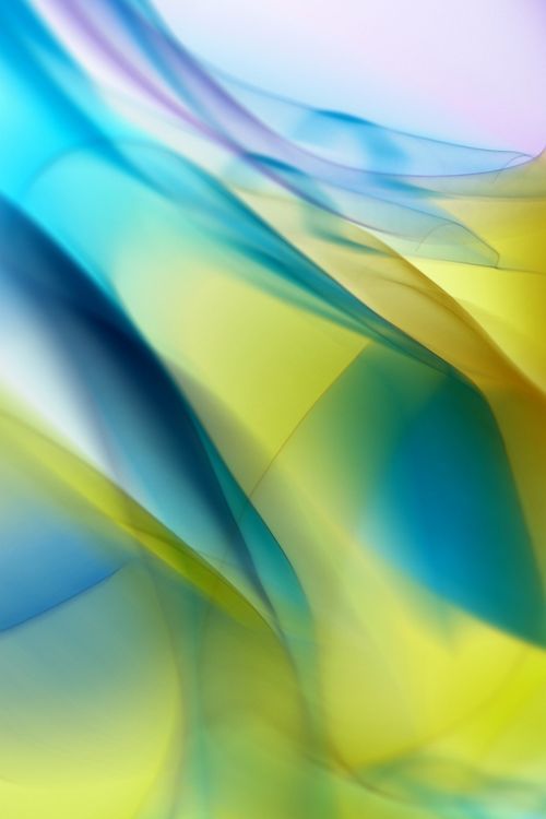 Free Colorful abstract art featuring flowing blue and yellow shapes creating a dynamic visual effect. Stock Photo