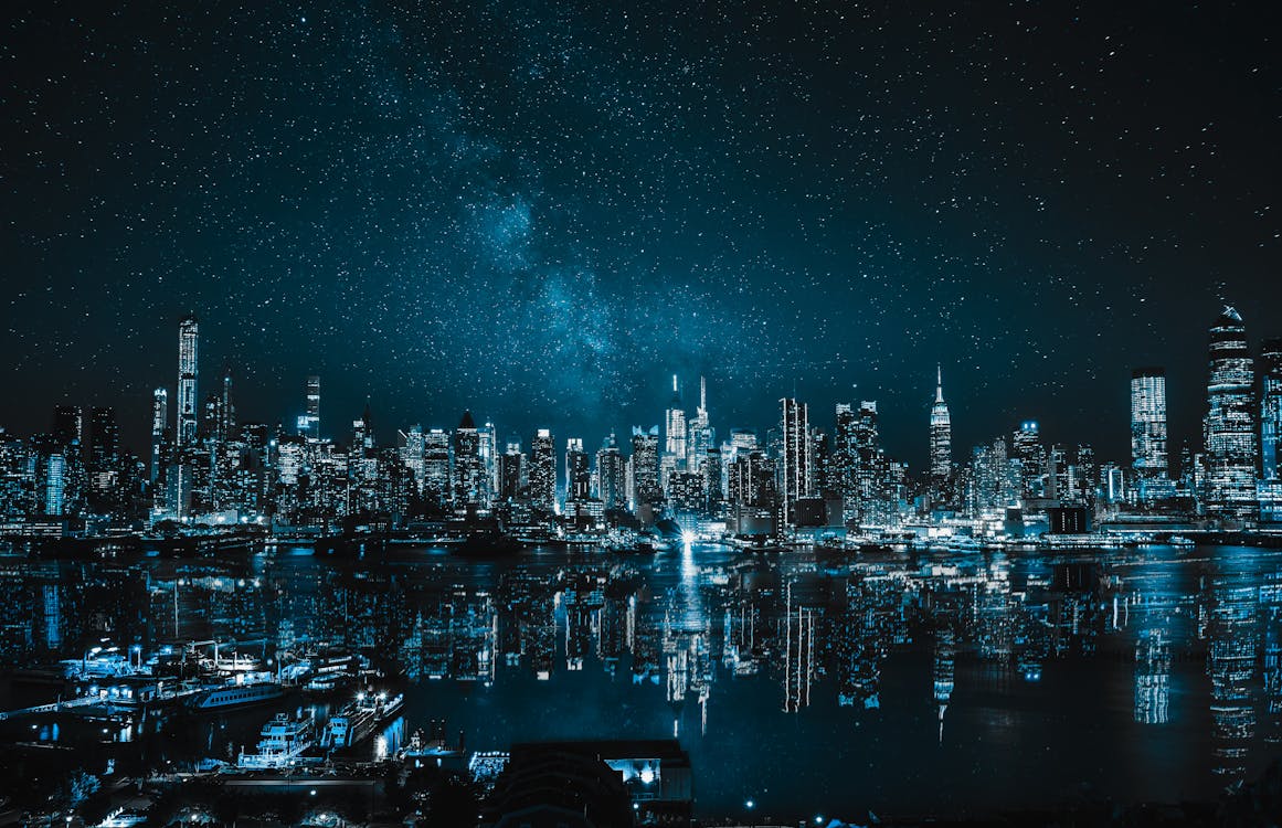 Panoramic View of City Buildings during Nighttime · Free Stock Photo