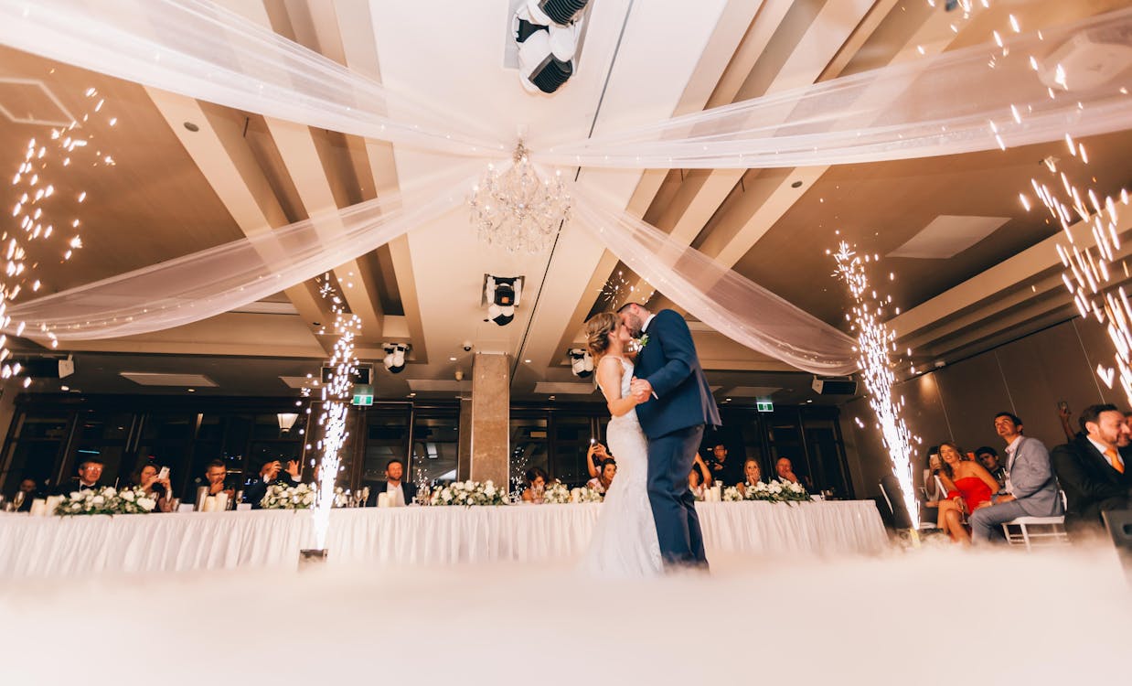 Low Angle Photography of Bride and Groom Dancing