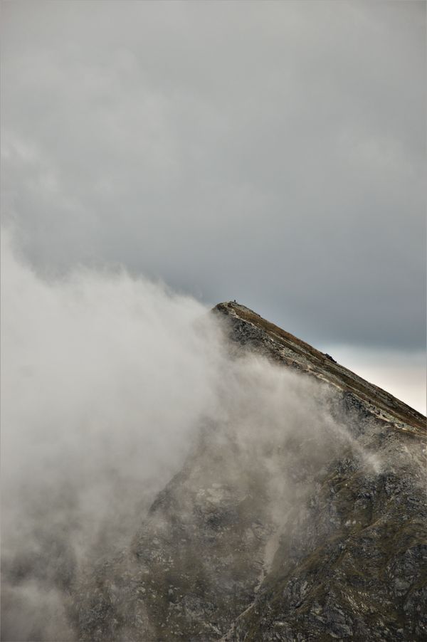 Ridge emerging from cloud — photo by Luise Biere on Pexels