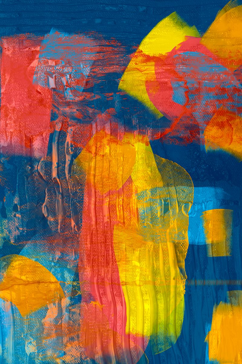 Dynamic abstract art piece with vivid blue, orange, and yellow hues, showcasing modern expressionism.