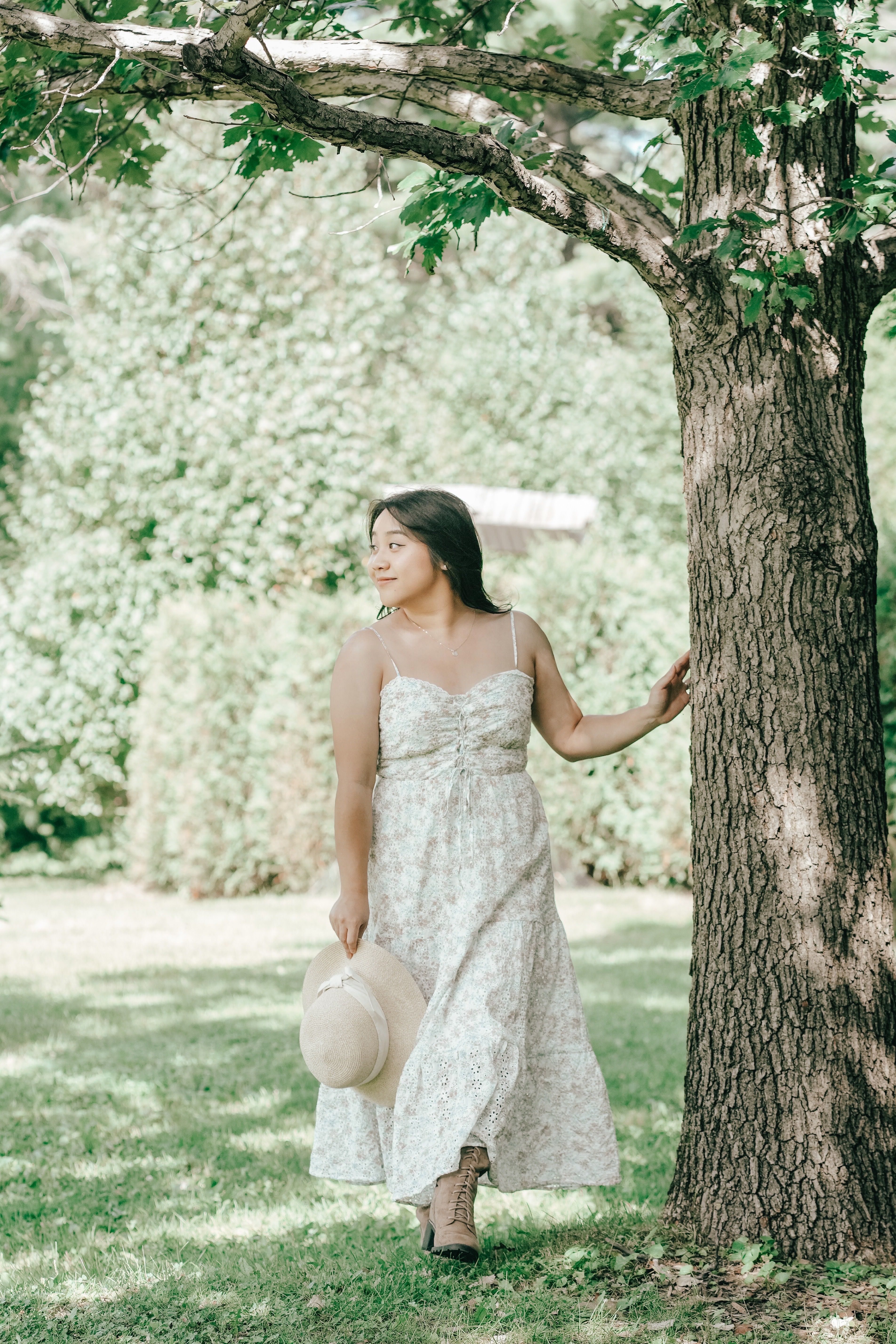 Young Woman in a Dress Walking in the Garden · Free Stock Photo