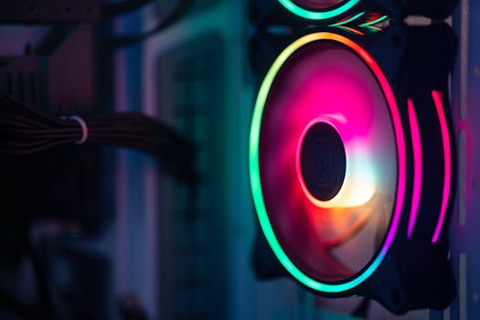 Close-up of a colorful RGB cooling fan in a gaming PC setup.