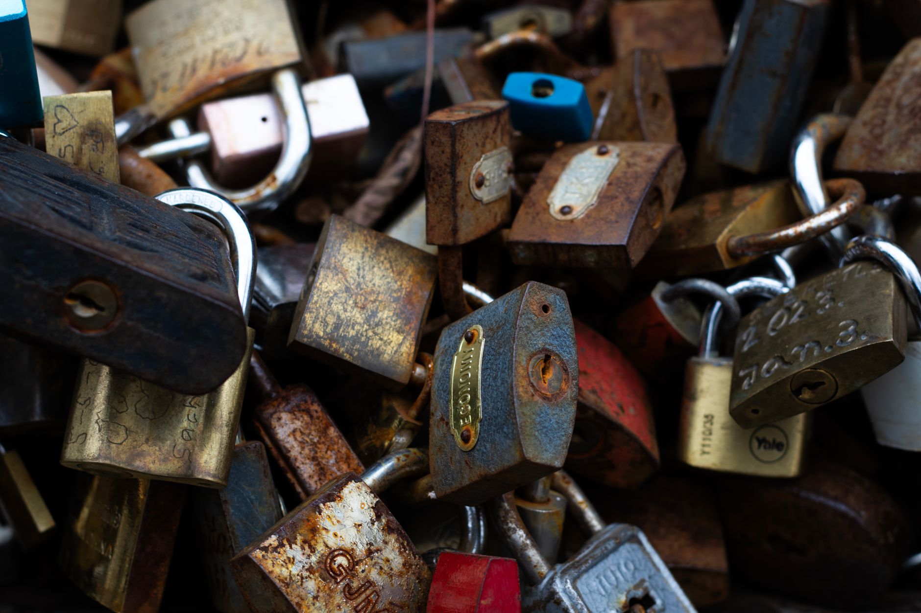 A vintage assortment of rusty padlocks showcasing age and history.
