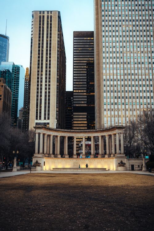 Free Dramatic view of the Millennium Monument set against Chicago's towering skyscrapers. Stock Photo