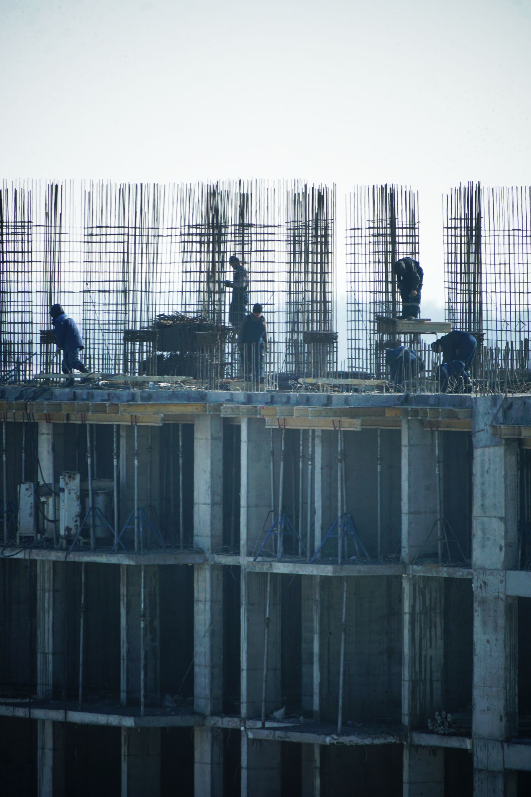 Workers at a high-rise construction site