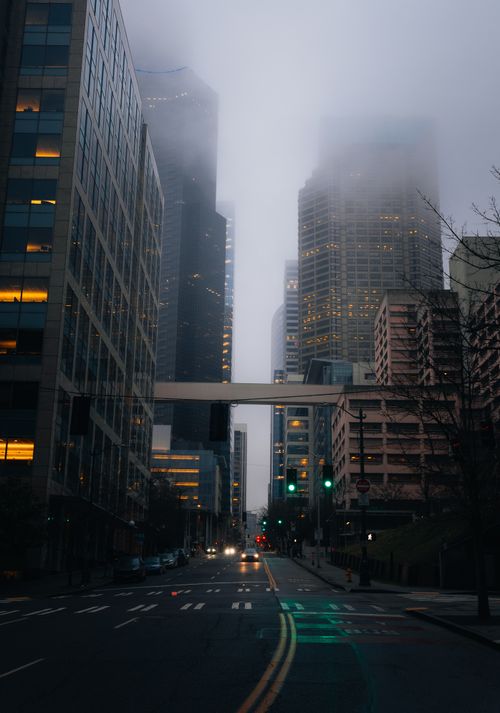Free Moody urban landscape of downtown Seattle with fog and towering buildings. Stock Photo