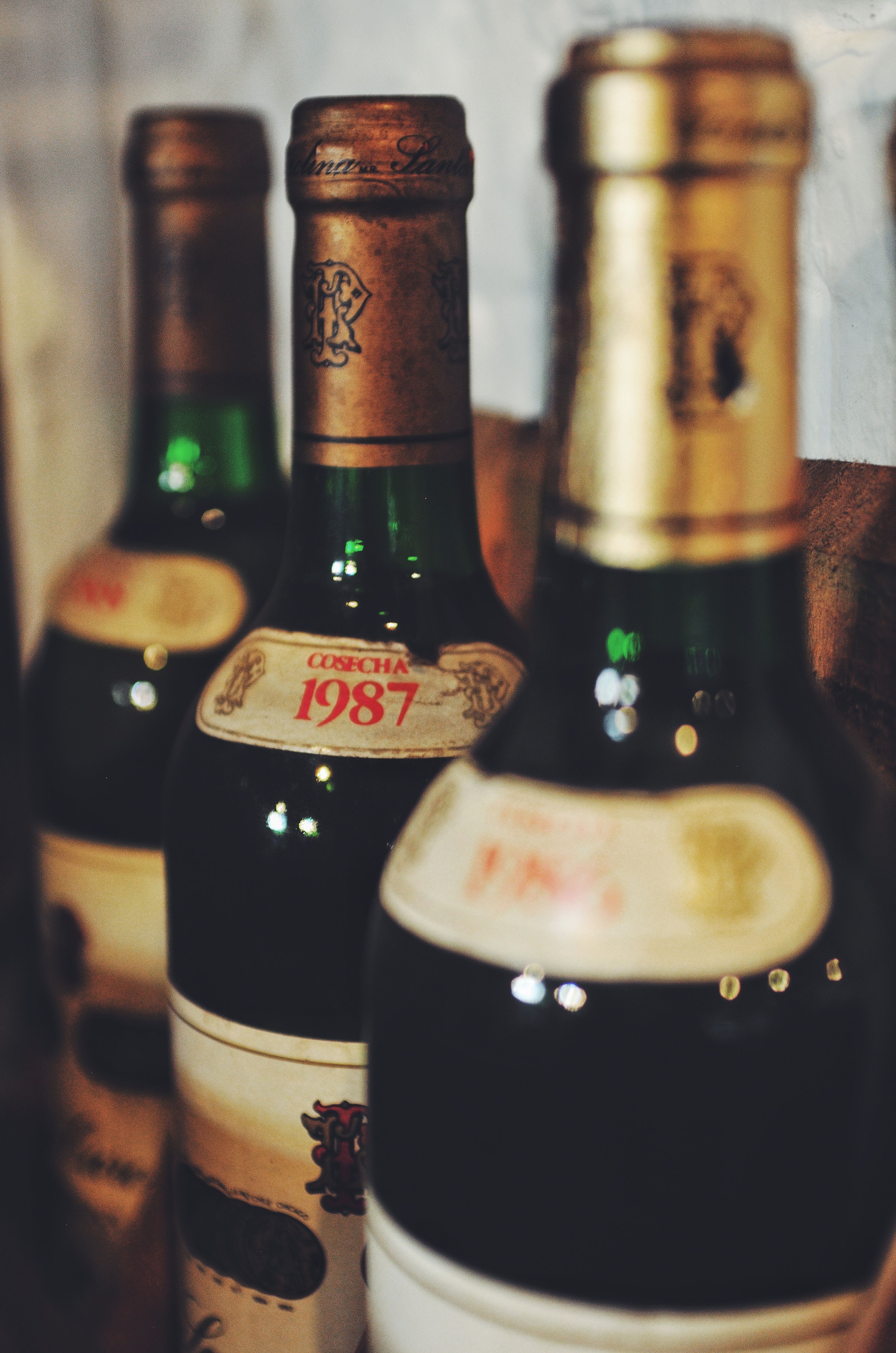 Close-up of vintage wine bottles showcasing rustic charm and nostalgia. Perfect for vintage collections.
