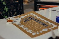 Decorative Calligraphy Design with Paint Supplies
