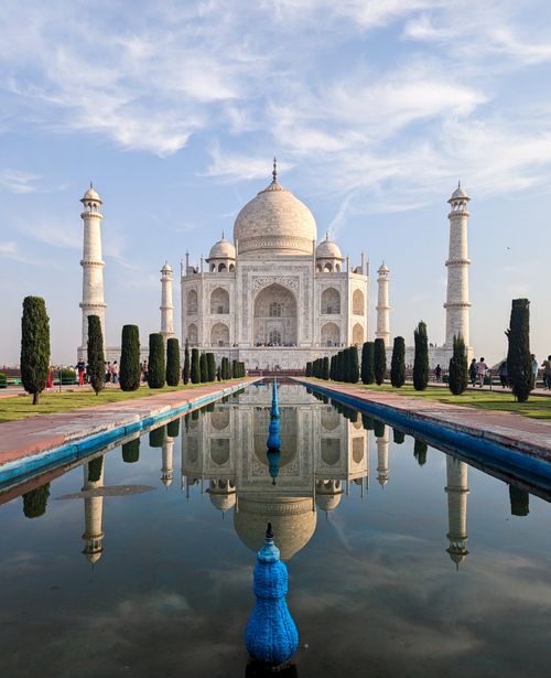 Free Iconic Taj Mahal with clear reflection in Agra, India. Captivating view on a sunny day. Stock Photo