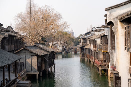 A serene view of traditional water town architecture in China during the day.