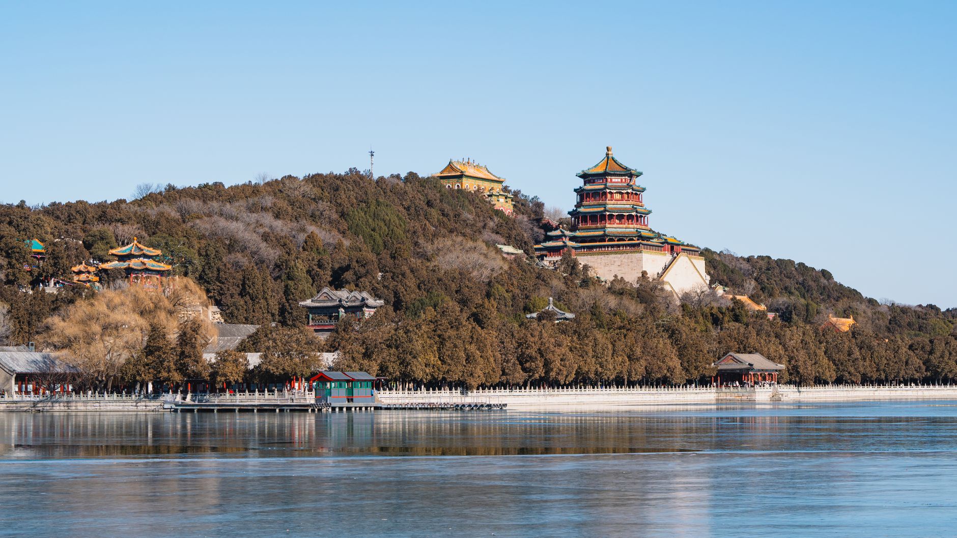 The Tower of Buddhist Incense rising on wooded Longevity Hill above Kunming Lake at the Summer Palace, Beijing