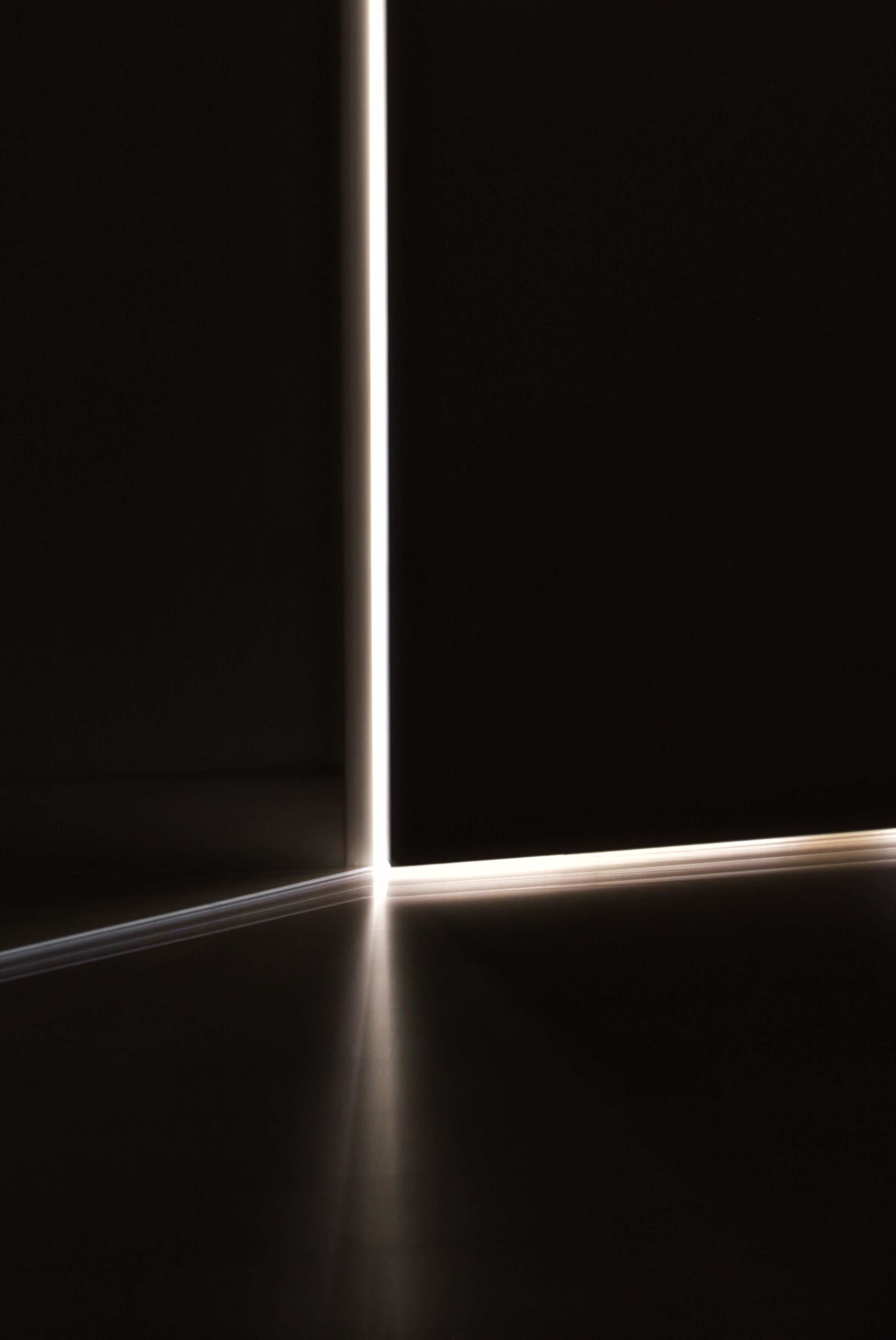 A single beam of light crossing a dark room