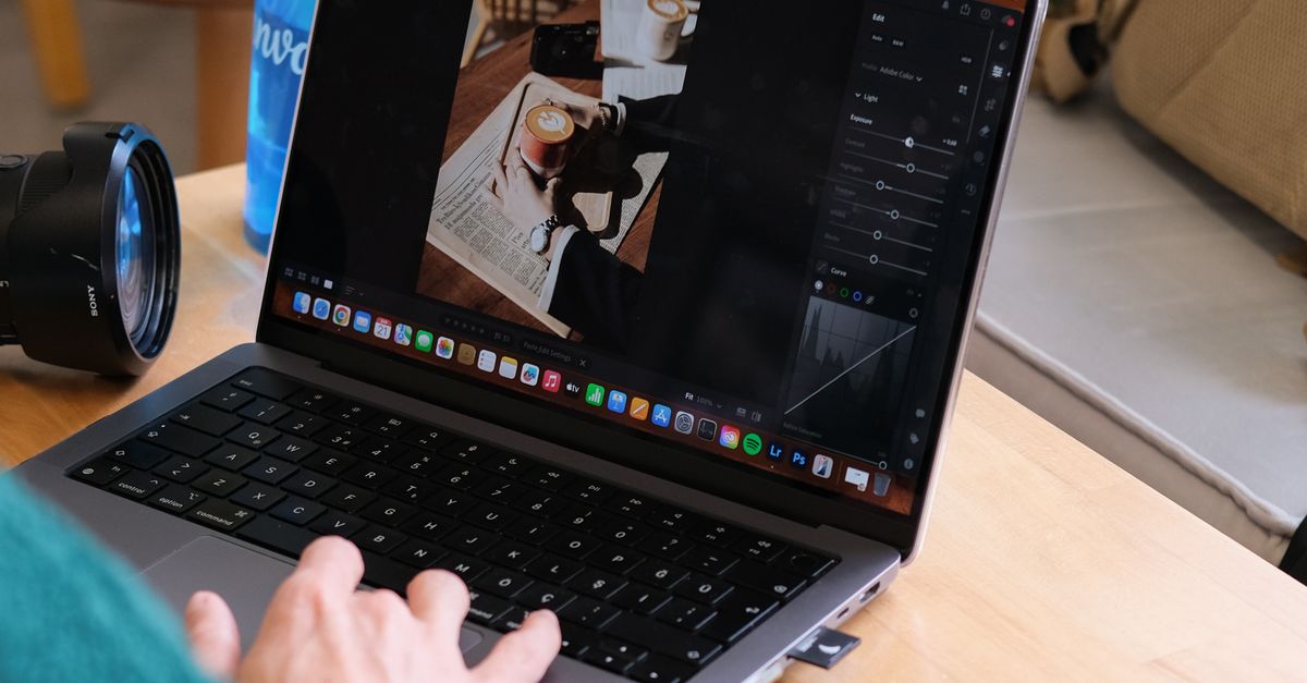 Editing Photos on a Laptop in Cozy Indoor Setting · Free Stock Photo