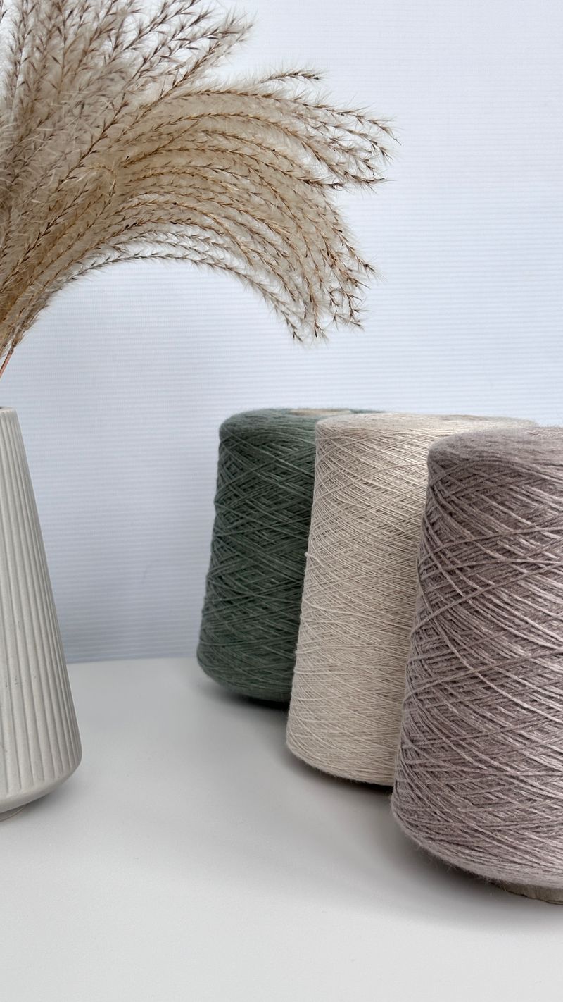 Cones of natural cotton yarn