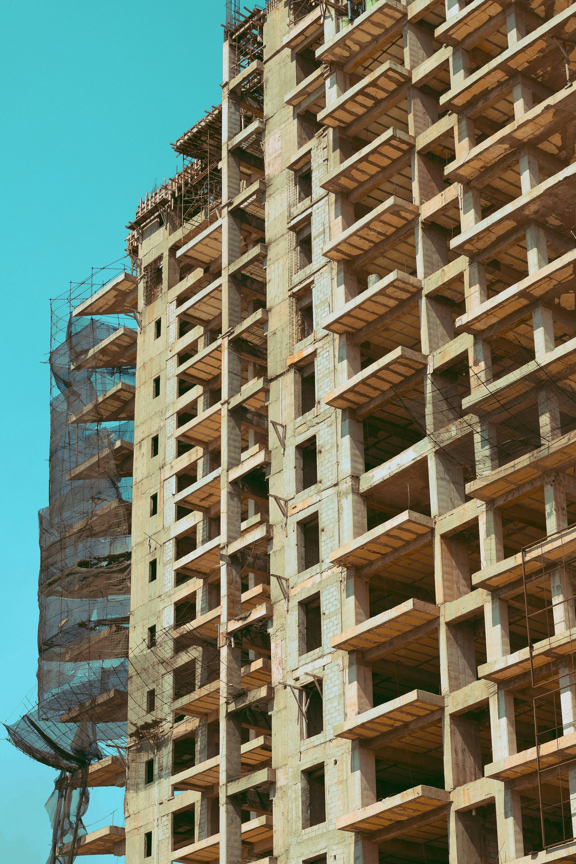 High-rise construction site in Puebla, Mexico, displaying pastel tones and urban development.