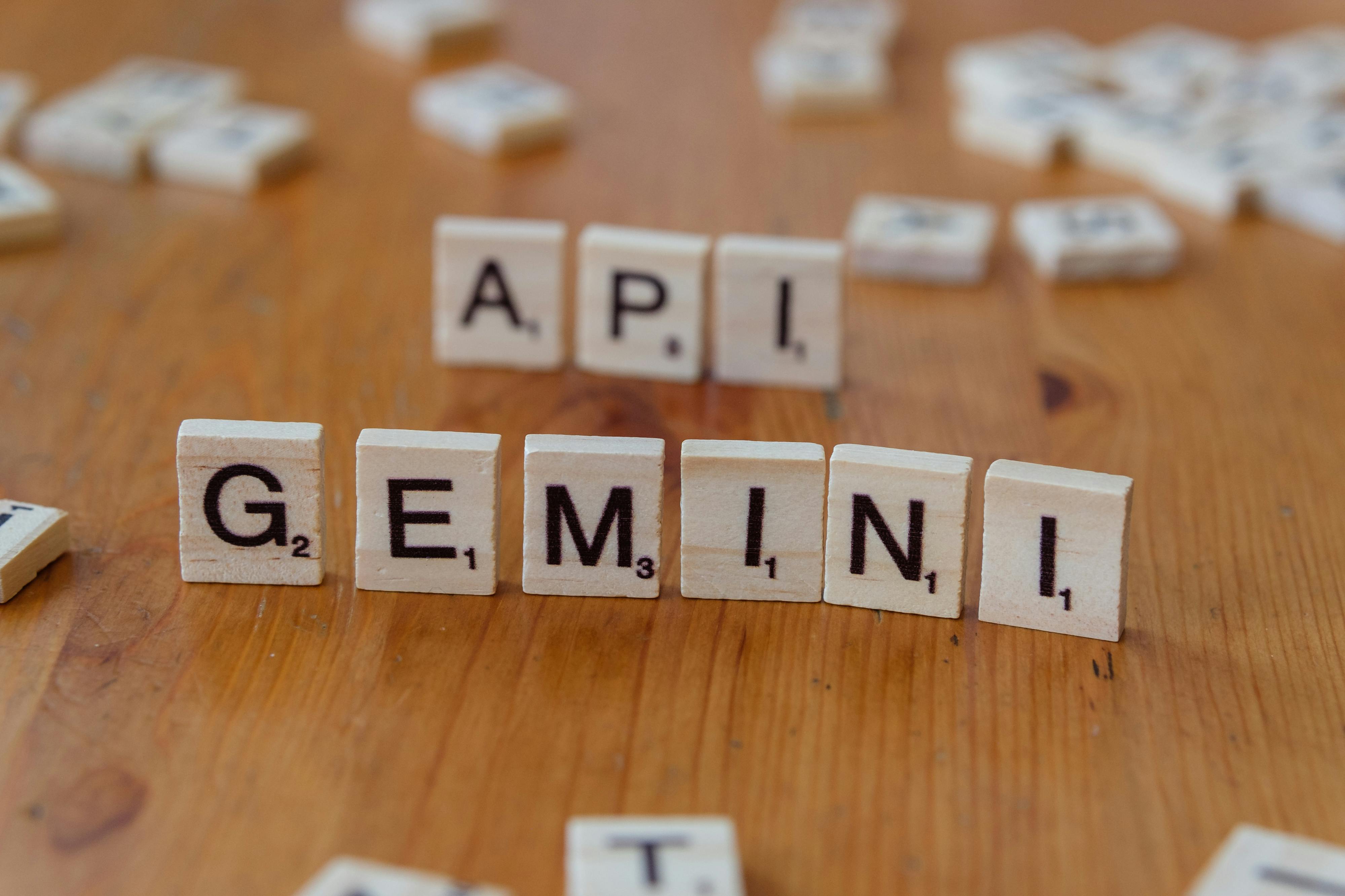 scrabble tiles displaying api and gemini