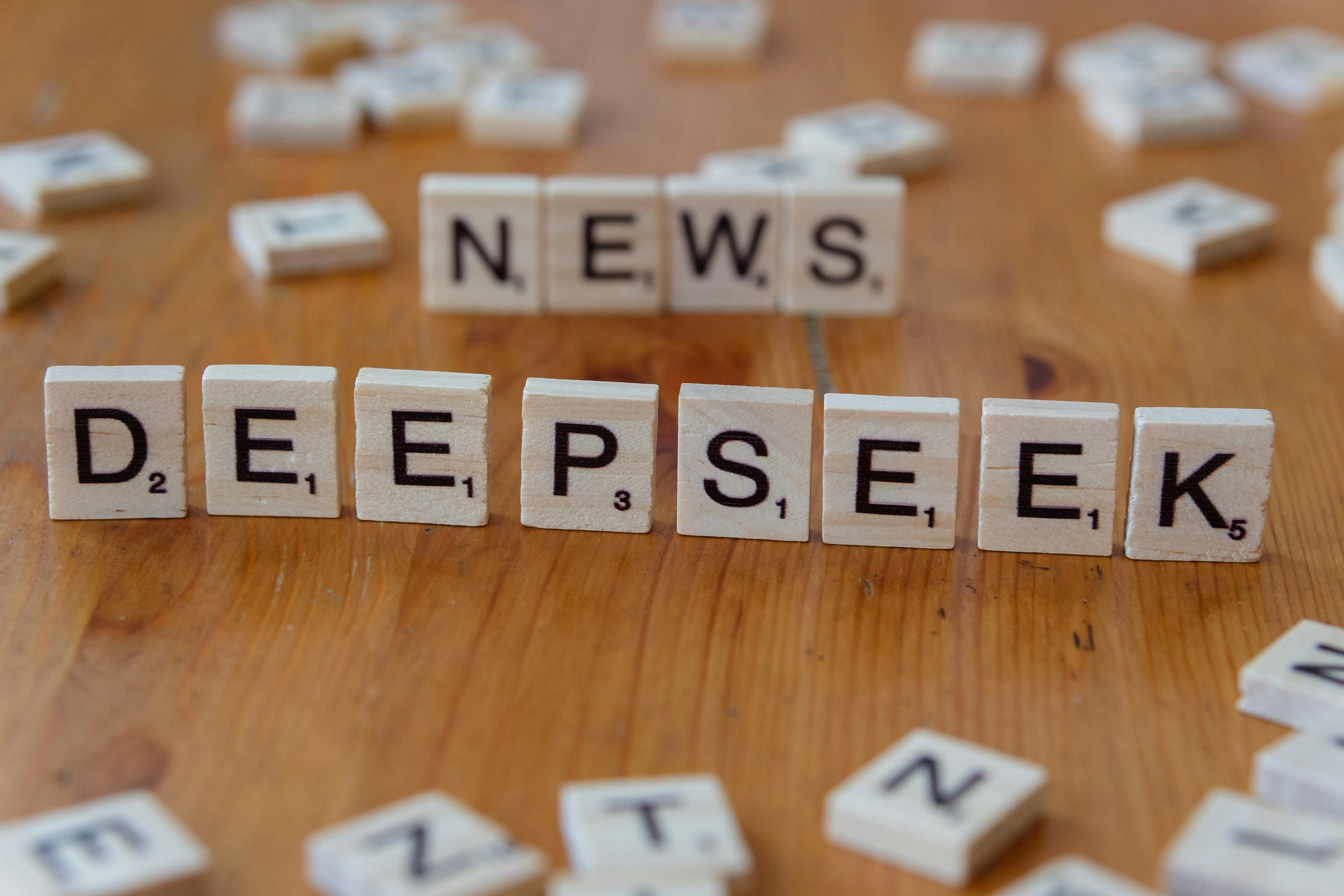 wooden scrabble tiles spelling deepseek on table