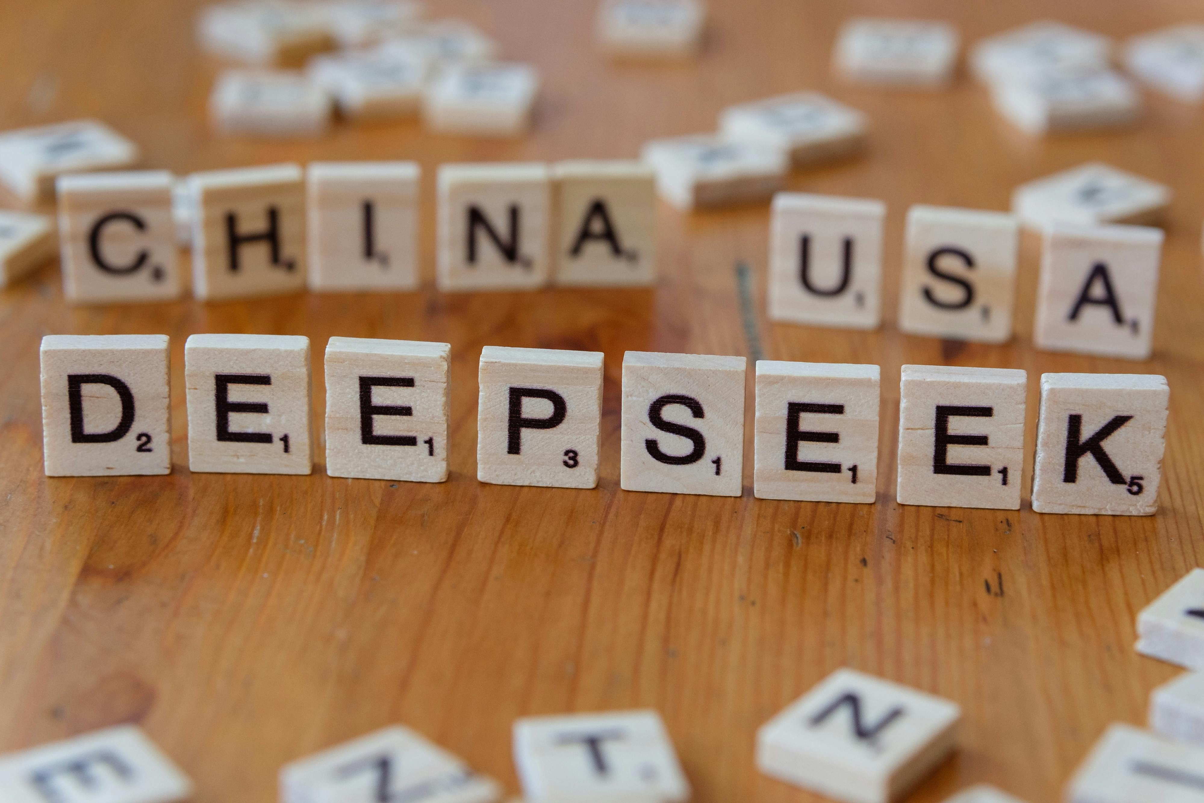 wooden letter tiles spelling deepseek on a board