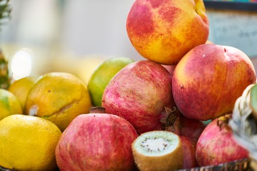 Free Vibrant assortment of fresh fruits including citrus, kiwi, and pomegranate, showcasing healthy, colorful produce. Stock Photo