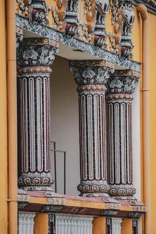 Free Detailed view of decorative architectural columns in Thua Thien Hue, Vietnam. Stock Photo