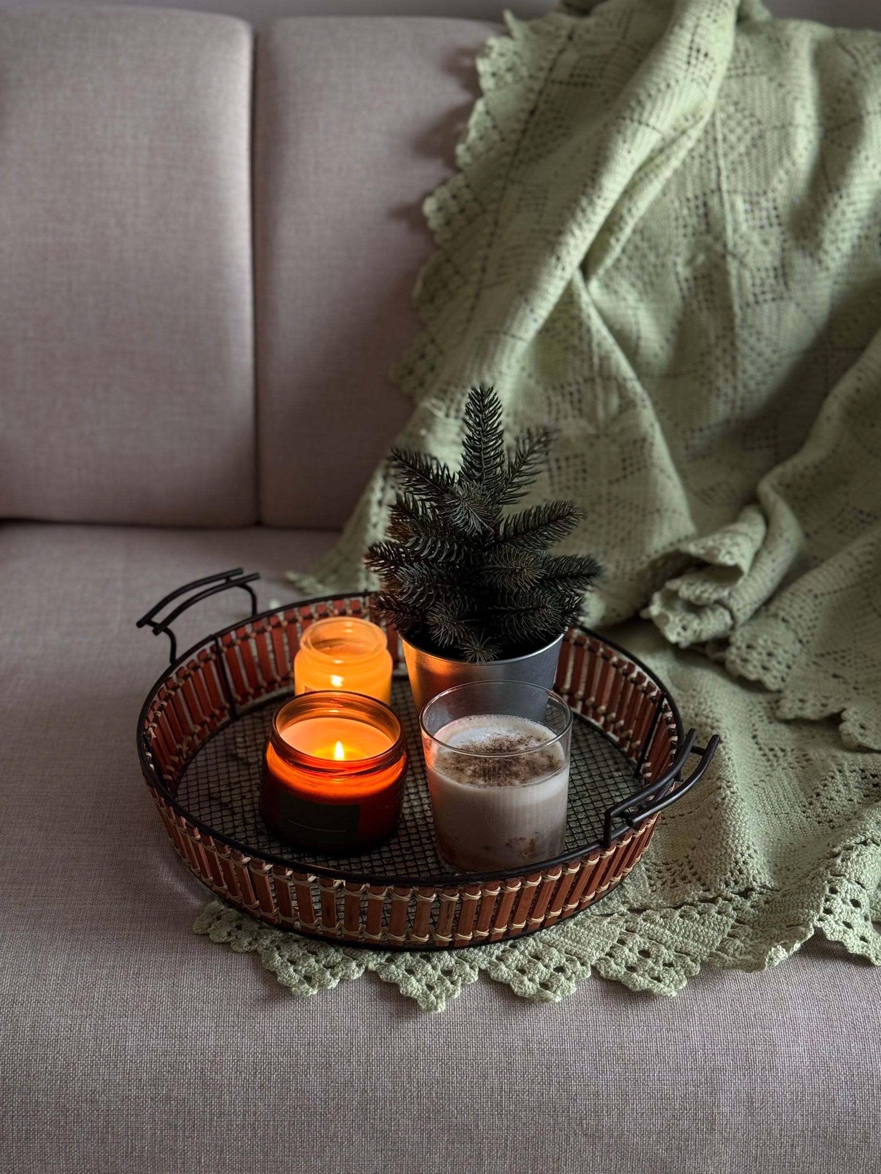 Blanket-and-candle living room vignette