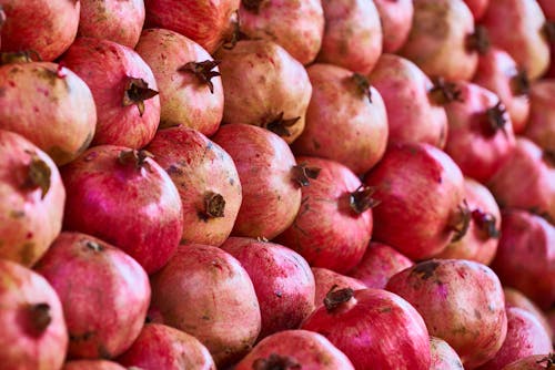 Close-up Photo of a Bunch of Pomegranates