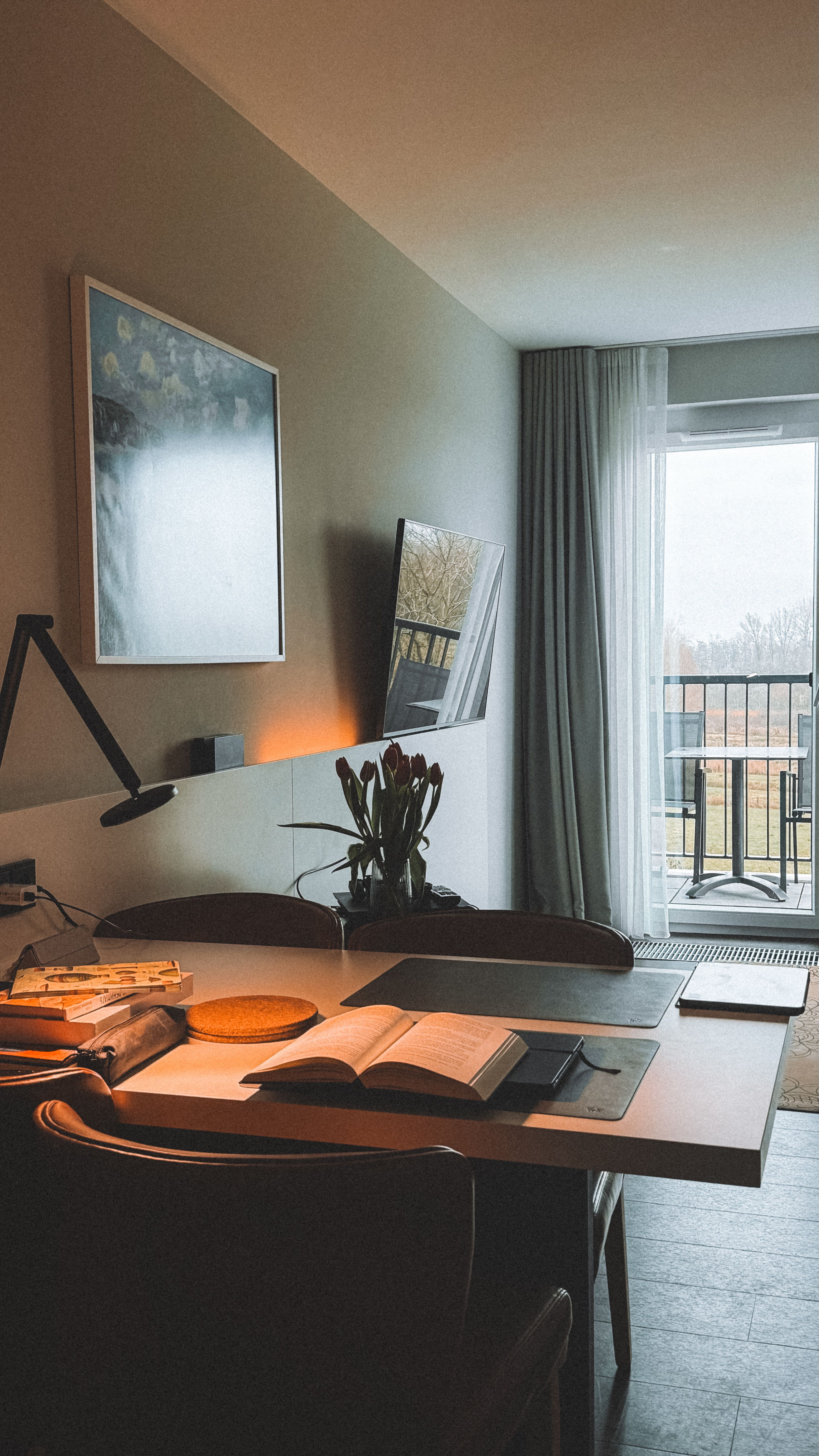 Stylish home office with natural light, books, and decor for productivity.