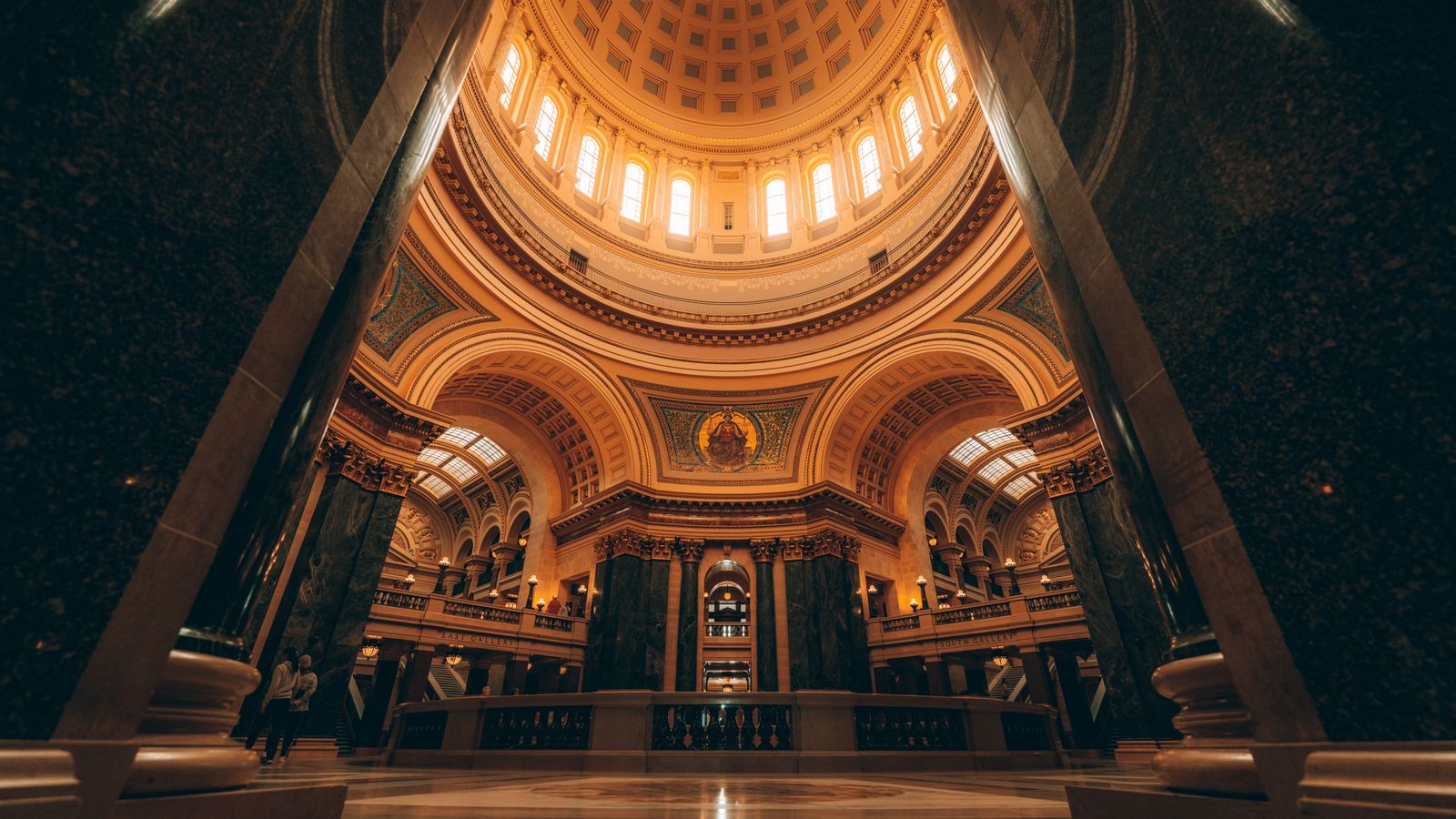 Stunning view of a grand dome interior with intricate architecture and warm lighting.