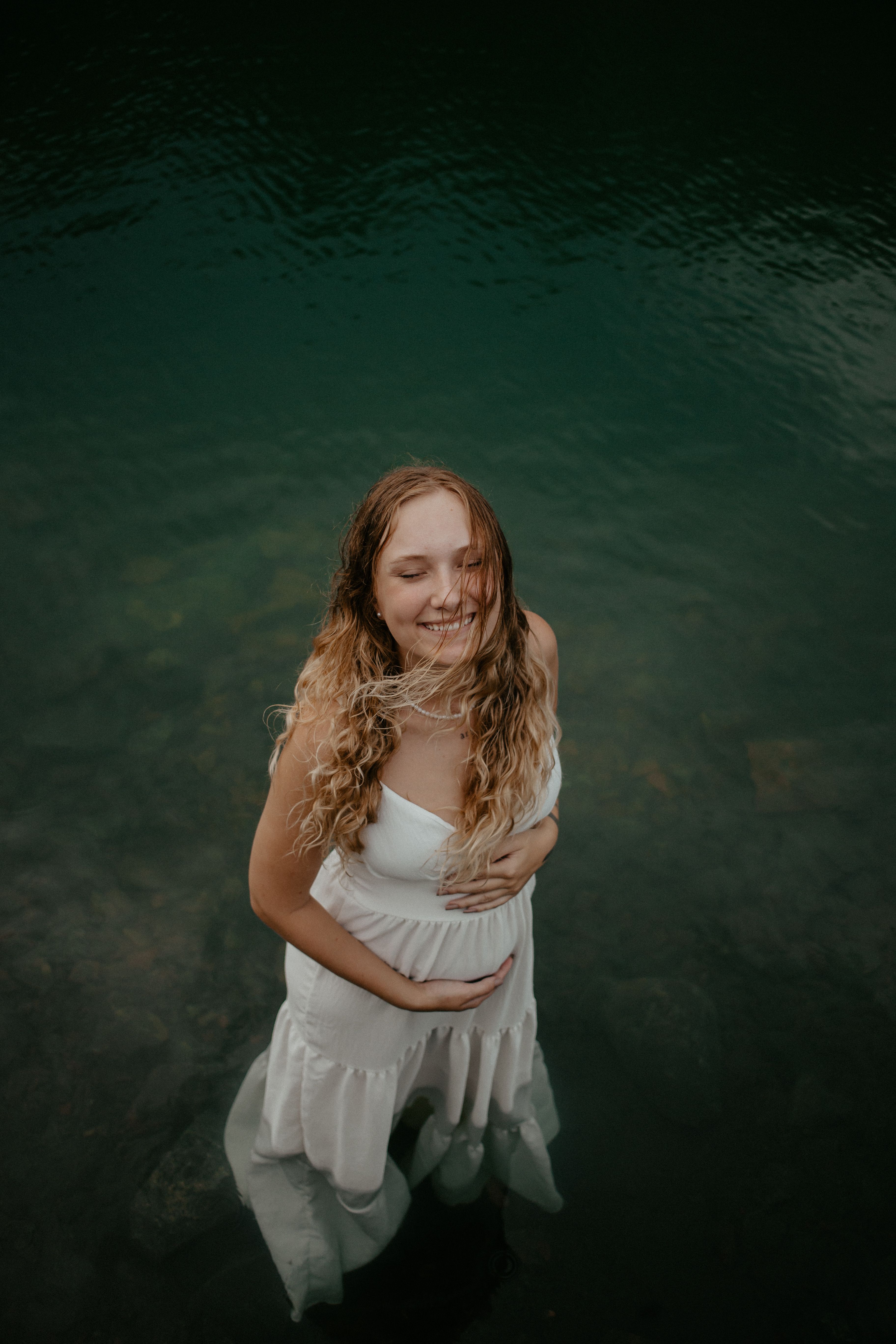 Young woman in white dress standing in water · Free Stock Photo