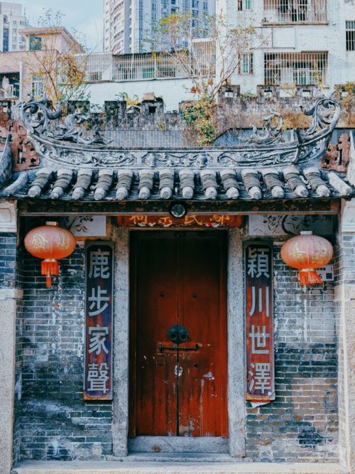 Free Ancient Chinese building facade with red lanterns and ornate roof design. Stock Photo