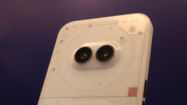 High-resolution close-up of a smartphone's dual camera lenses on a sleek device.