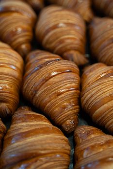 Golden brown croissants in a Berlin bakery showcase delicious artisanal craftsmanship.