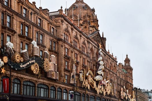 The iconic facade of Harrods in Knightsbridge adorned with festive decorations and a holiday theme.