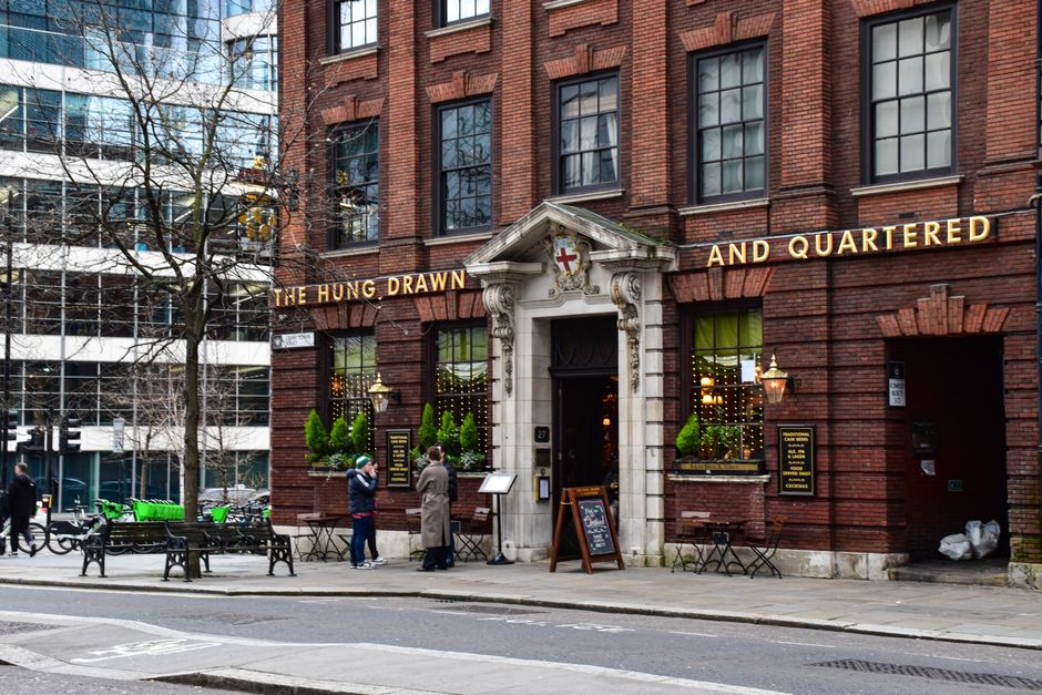 Exterior view of The Hung Drawn and Quartered pub in London, England, showcasing its historic architecture.