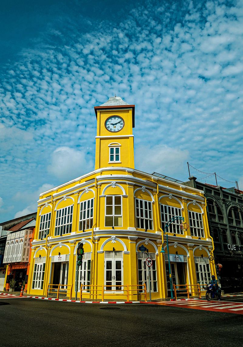 Yellow Sino-Portuguese clock tower building in Old Phuket Town