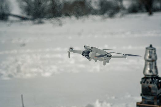 Aerial view of a drone navigating through a snowy landscape in Şile, İstanbul.