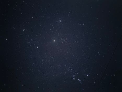 A clear view of the starry sky with bright stars scattered across the night.