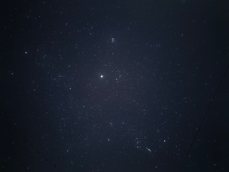 A clear view of the starry sky with bright stars scattered across the night.