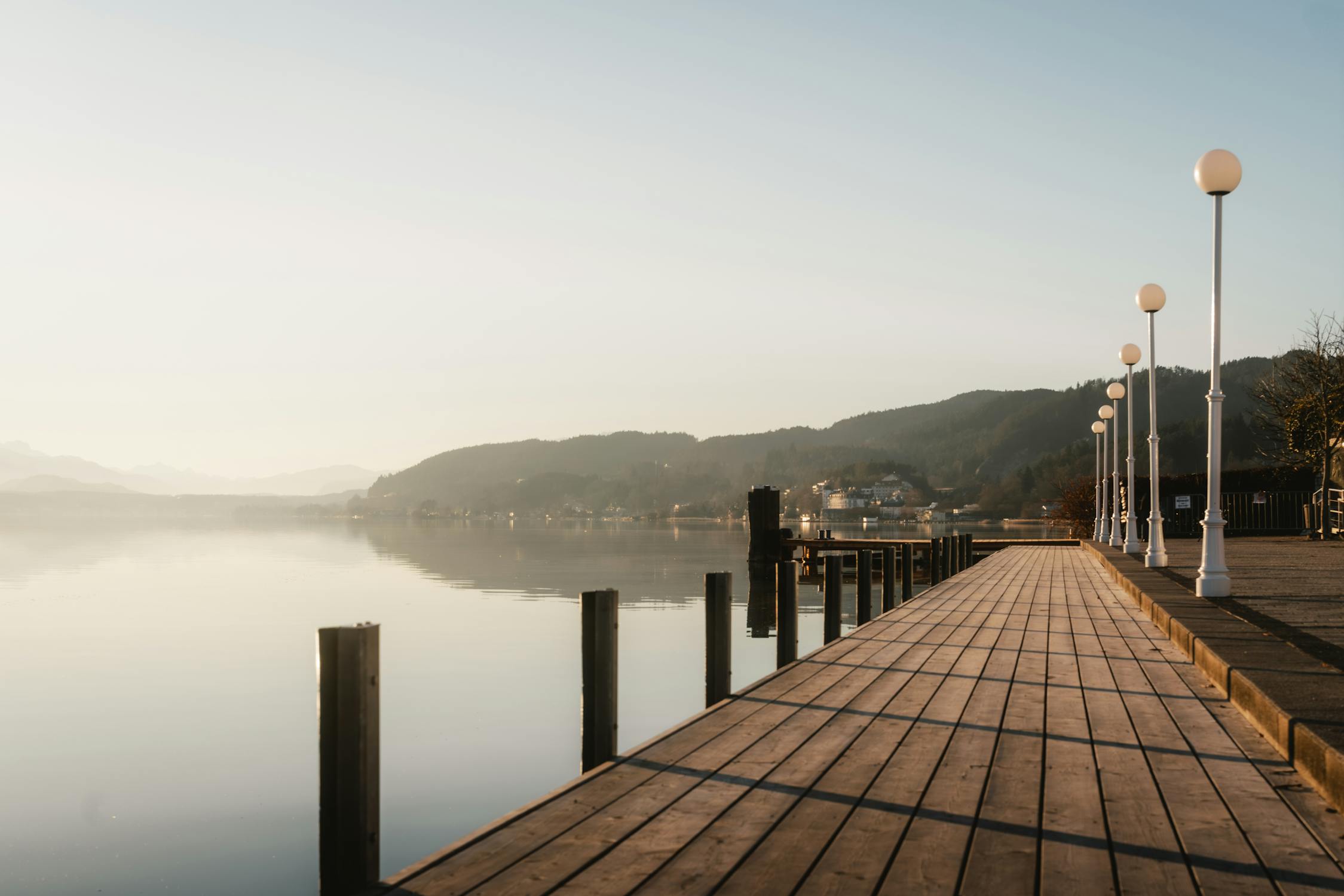 Serene Lakefront Promenade at Sunrise · Free Stock Photo Serene Lakefront Promenade at Sunrise · Free Stock Photo