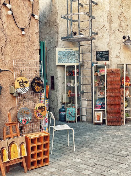 Free Artisan crafts displayed outside a shop with decor items and rustic charm. Stock Photo